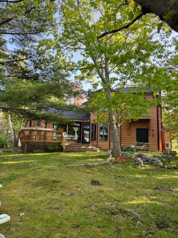 Back elevation of Maine home restoration project with new windows.