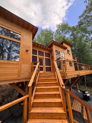 Wooden stairs leading up to screen room breezeway.