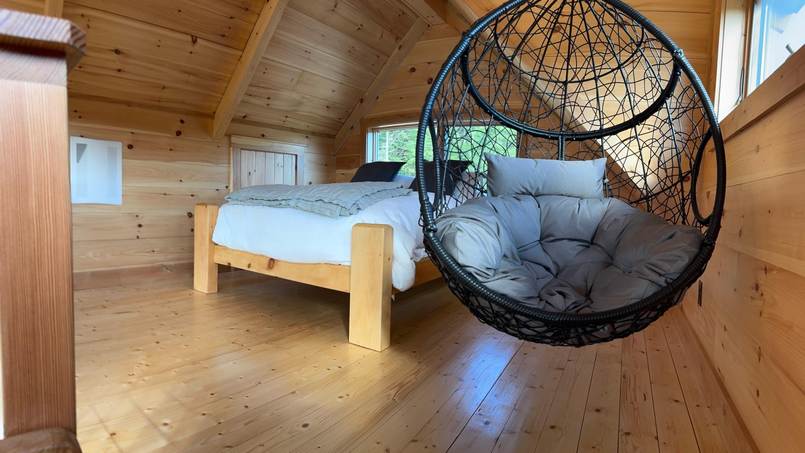 A frame loft in a post and beam cabin construction.