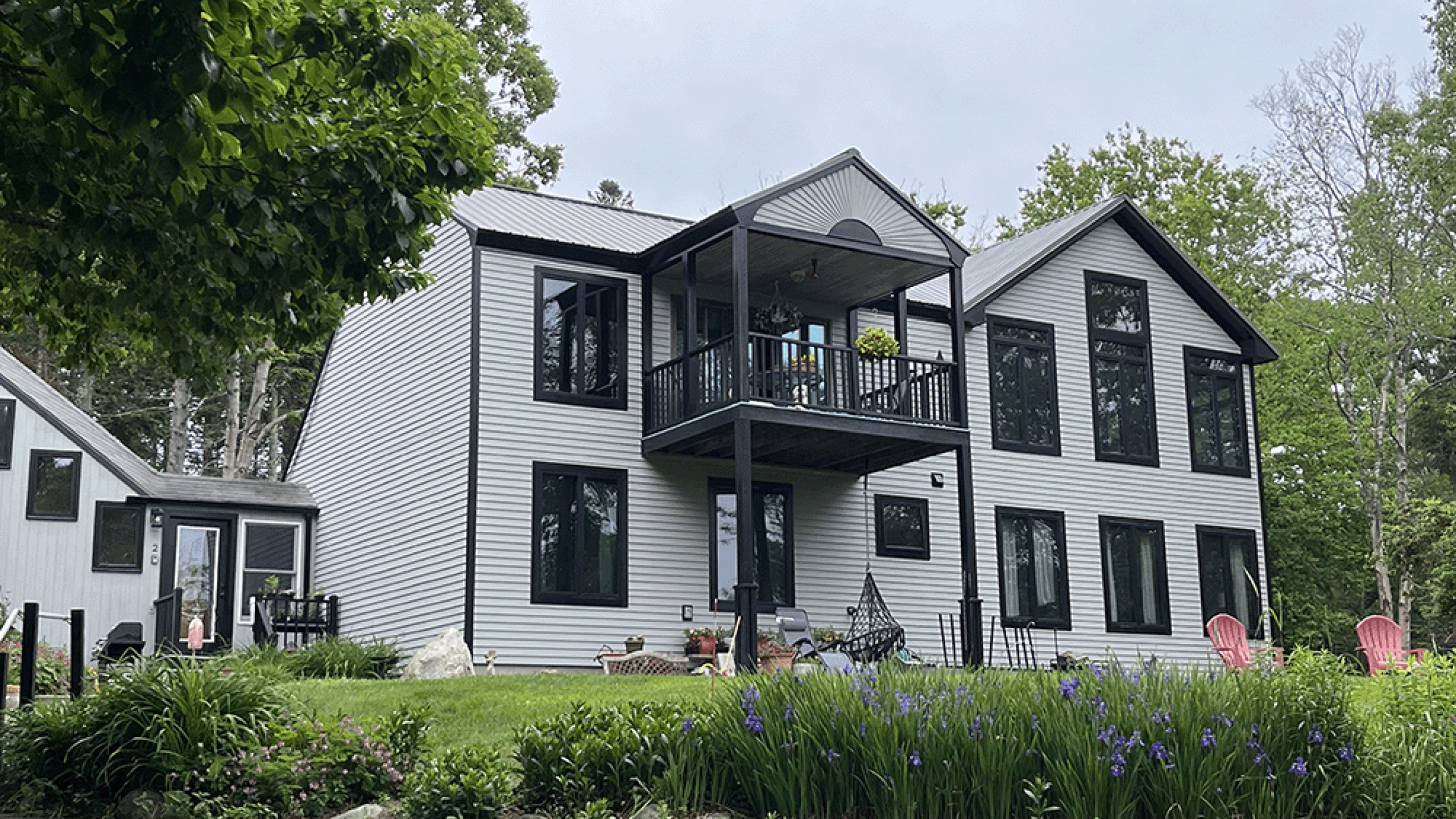Front of two story coastal Maine property with new driveway.