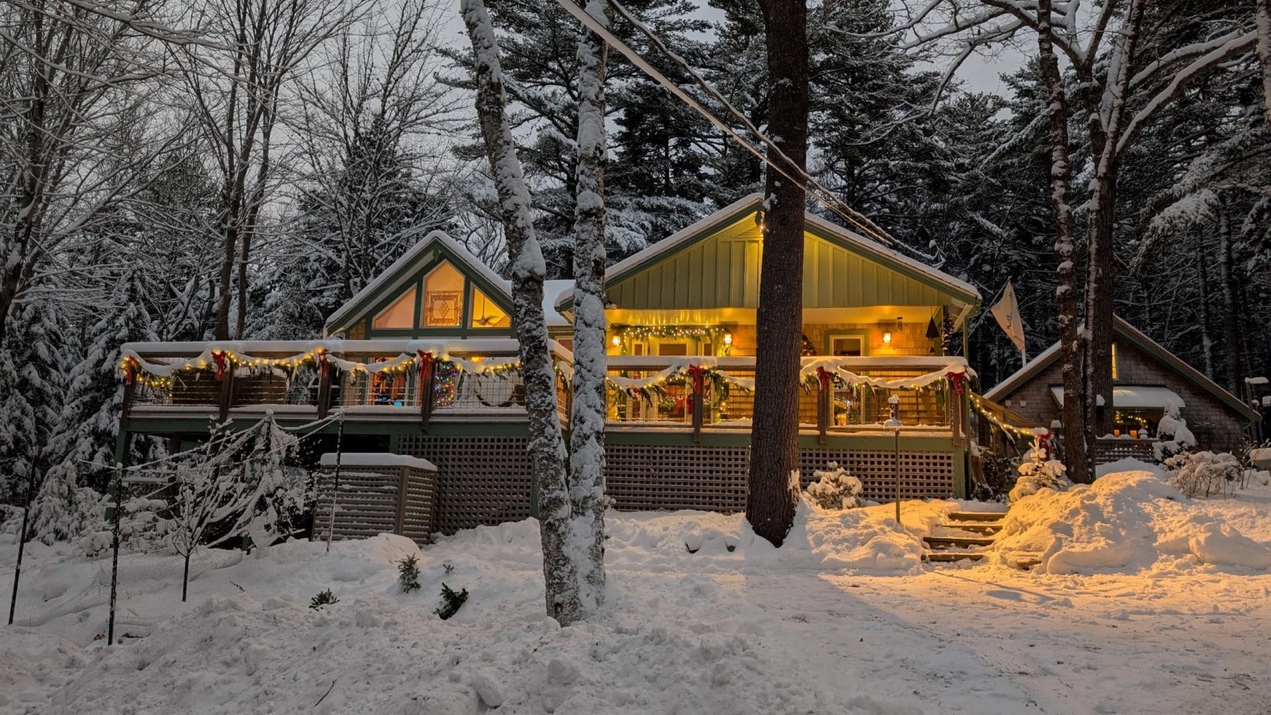 Green cabin in the snow.