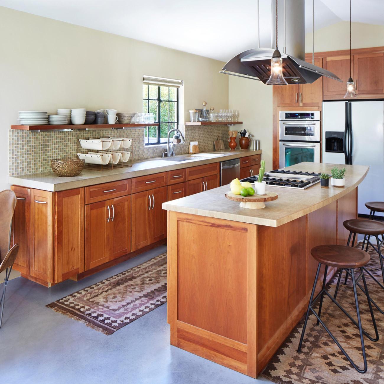 Kitchen Island remodel with hood and custom wood cabinetry.