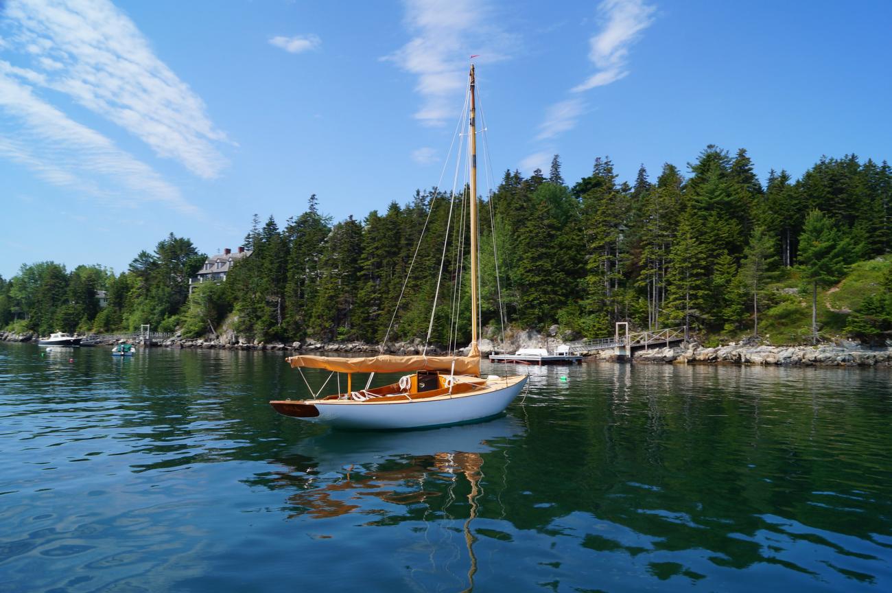 Sailboat floating in the summer at Great Cranberry Island, Maine near Southwest Harbor.
