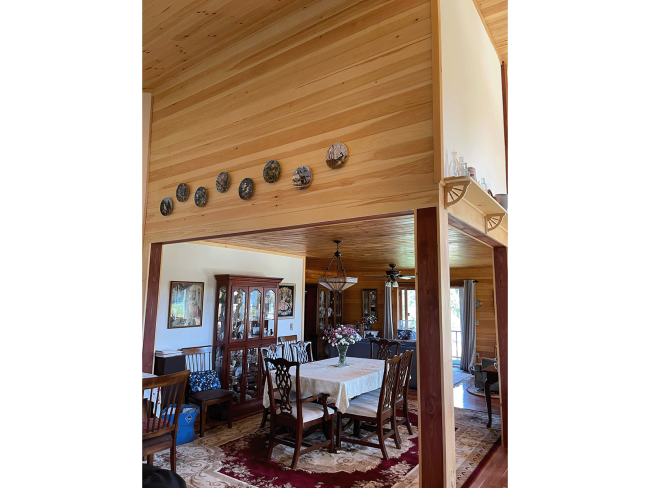 Post with wood slat walls and ceiling with finished corners.