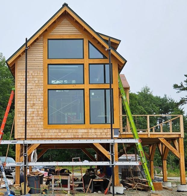 Picture frame window in custom cabin built near Ellsworth, Maine.