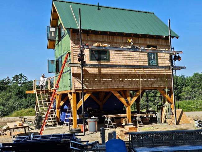 Shingle siding on stilted wood cabin near Ellsworth, Maine.
