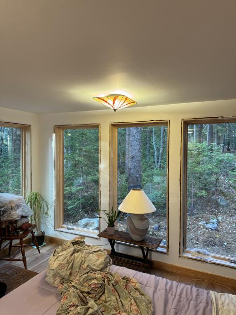 In progress installation of new, bright, minimal windows.