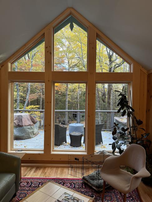 A full cathedral height window in this retirement cabin near Bar Harbor.