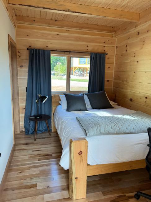 ADA interior master bedroom of wood cabin built at a Maine camp near Ellsworth.