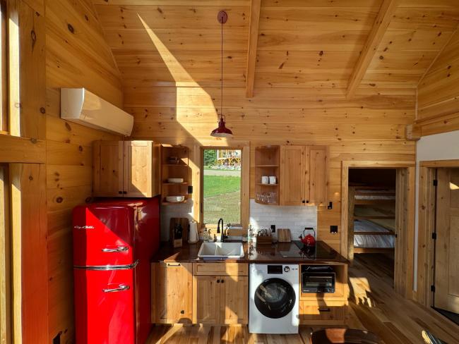 Finished, cabin kitchen with space saving appliances.