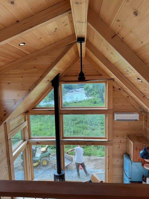 Vaulted cabin ceilings designed and built with large, open windows.