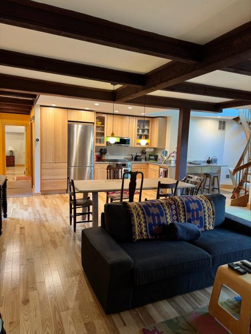 Open-concept kitchen, dining, and living room remodel.