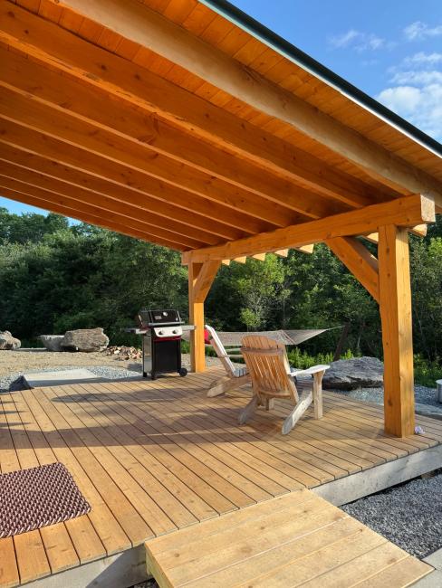 Shaded seating area constructed with large awning.