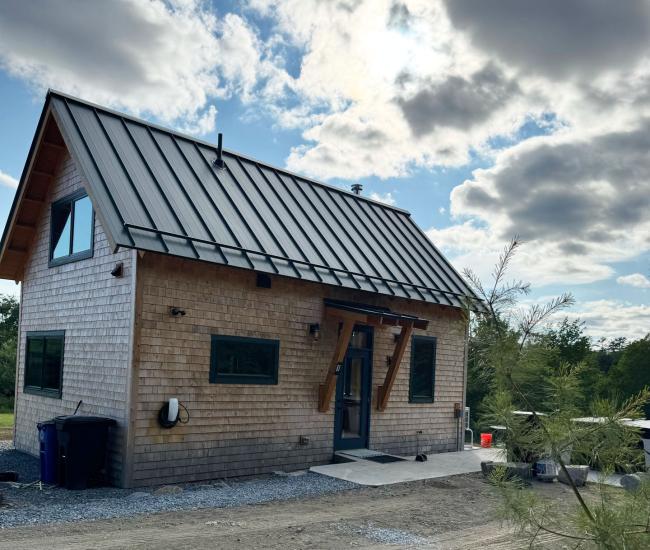 The Cherry ADA accessible cabin with metal roofing and wood shingle siding constructed in Maine near Ellsworth.