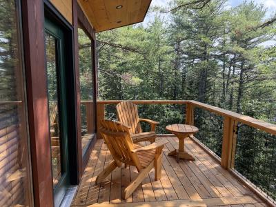 View from the balcony porch looking into the woods.