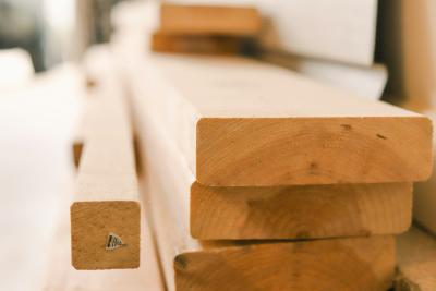 Looking down the planks of stacked lumber.